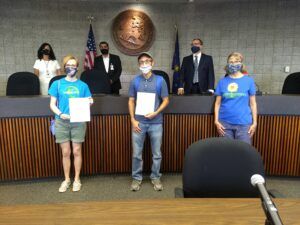 Photo of 3 volunteers and 3 Lake County Council members posing with signed resolution